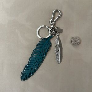 Coach feather charm